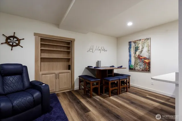 a view of a workspace with furniture and a piano