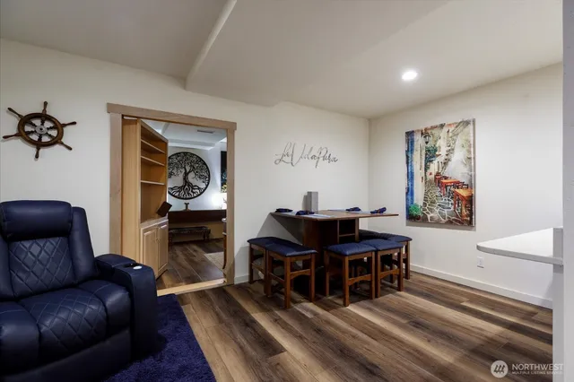 a living room with furniture and a piano