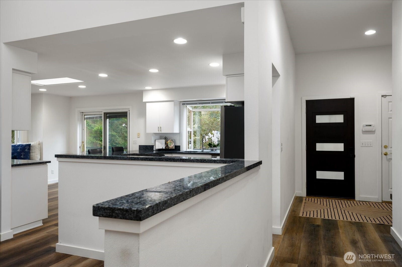 209 East Sara Vista Road Coupeville, WA 98239 - Photo 37 of 40 a kitchen with stainless steel appliances granite countertop a stove and a refrigerator