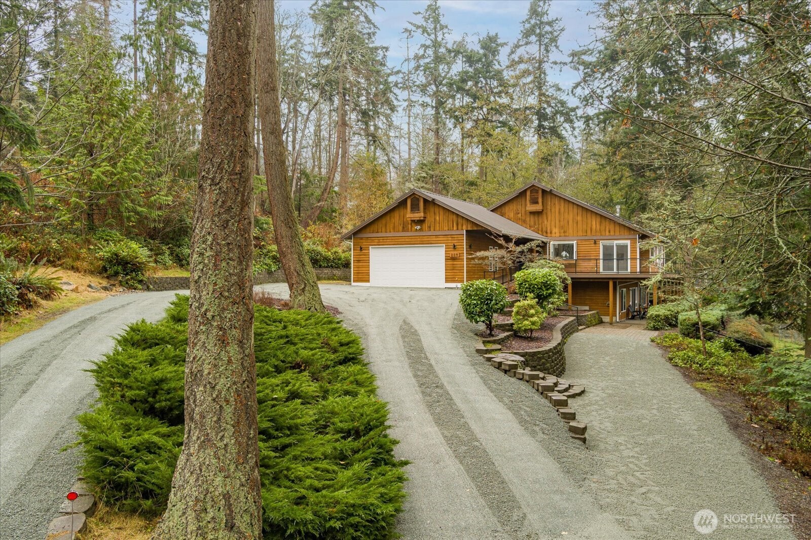 209 East Sara Vista Road Coupeville, WA 98239 - Photo 40 of 40 a house with trees in front of it