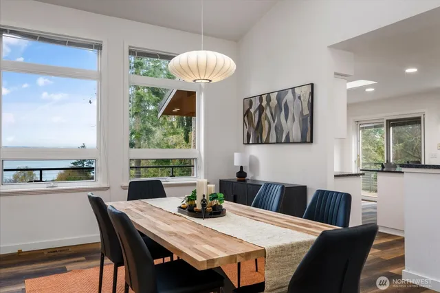 a view of a dining room with furniture window and outside view