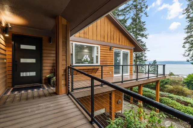 a view of balcony with wooden floor and fence