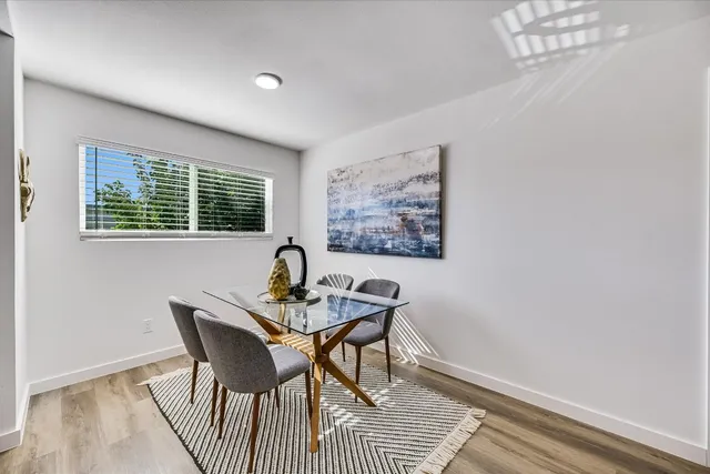 a view of a dining room with furniture window and outside view