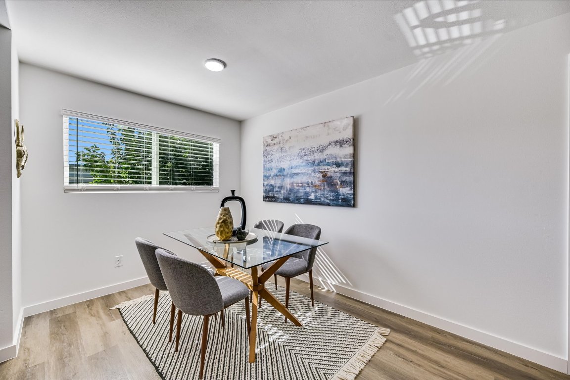 3703 Harmon Avenue, Unit 206 Austin, TX 78705 - Photo 5 of 10 a view of a dining room with furniture window and outside view