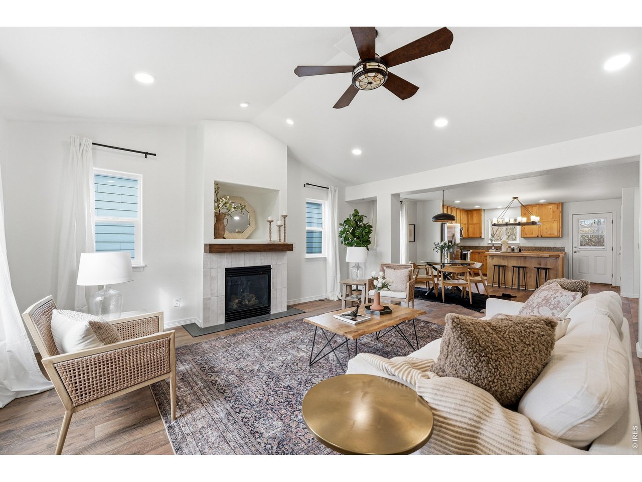2802 Pleasant Valley Road Fort Collins, CO 80521 - Photo 2 of 17 a living room with furniture a fireplace and a chandelier