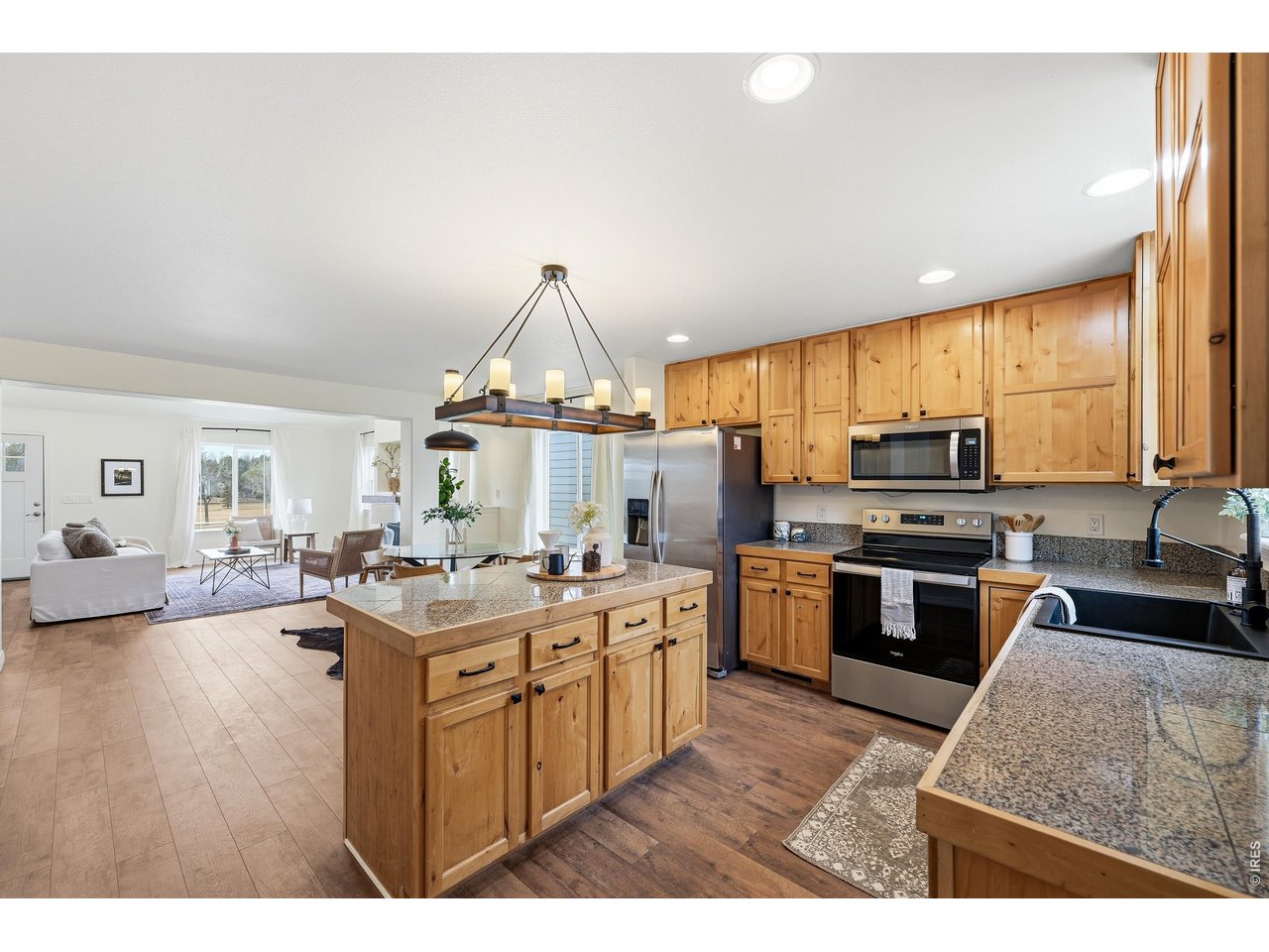 2802 Pleasant Valley Road Fort Collins, CO 80521 - Photo 6 of 17 a kitchen with a stove a sink and a refrigerator