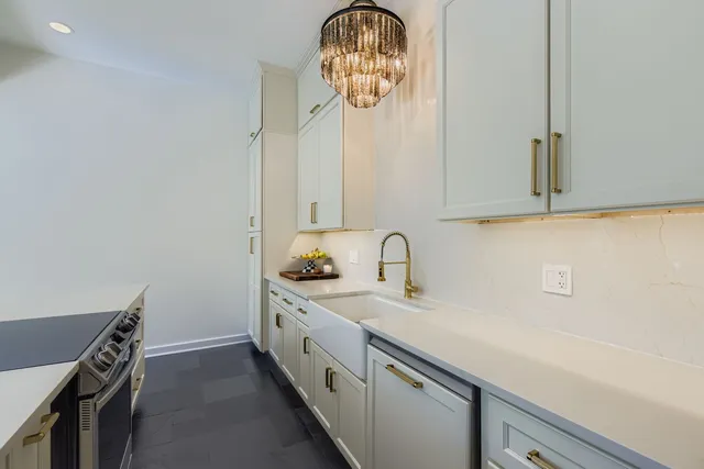 a kitchen with a sink and cabinets
