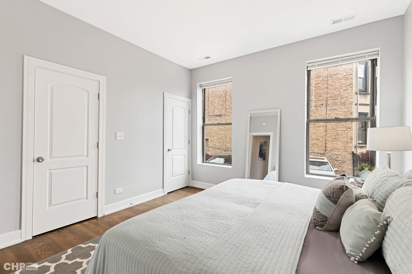 416 East 44th Street, Unit 1 Chicago, IL 60653 - Photo 20 of 25 a bedroom with a bed and window