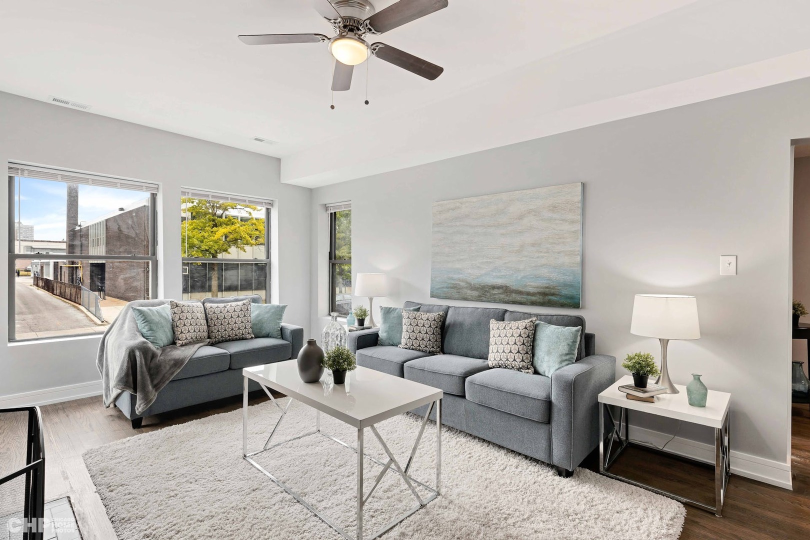 416 East 44th Street, Unit 1 Chicago, IL 60653 - Photo 2 of 25 a living room with furniture and a large window
