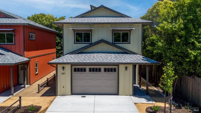 a front view of a house with a garage