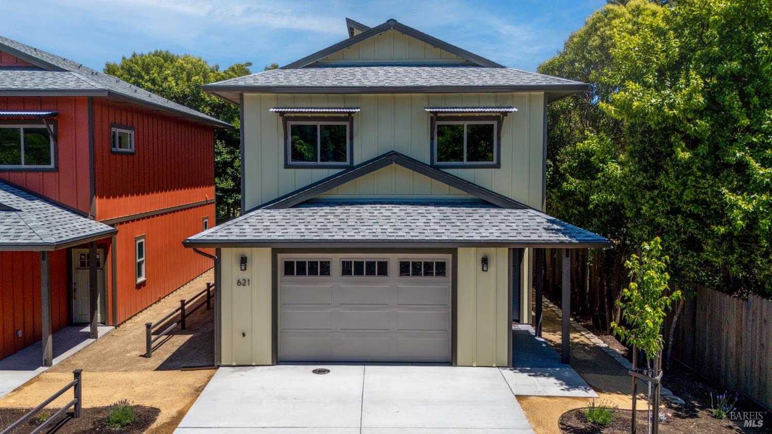 a front view of a house with a garage