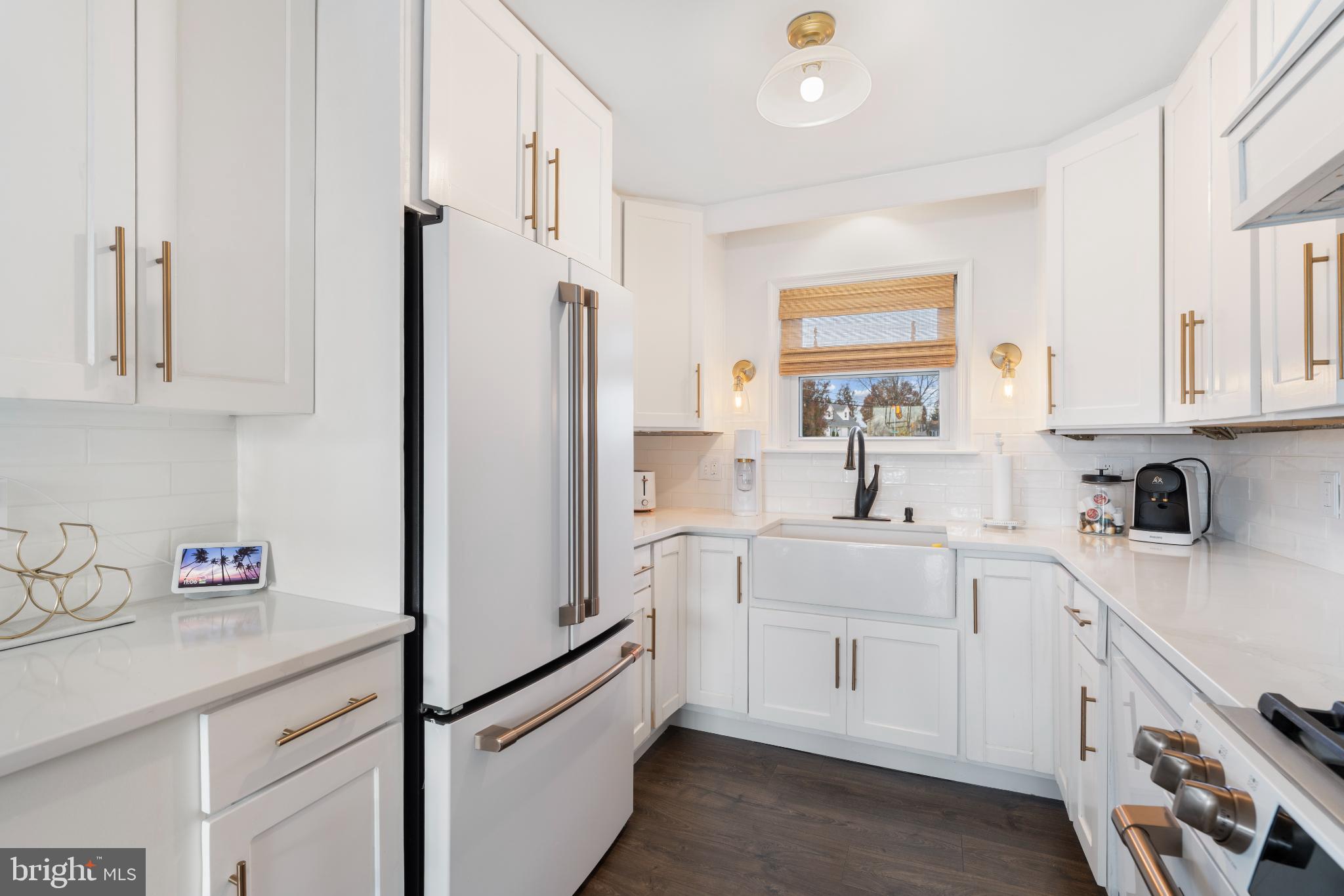 4501 Sandra Lake Road Perry Hall, MD 21128 - Photo 12 of 38 Modern kitchen with sleek white cabinetry.