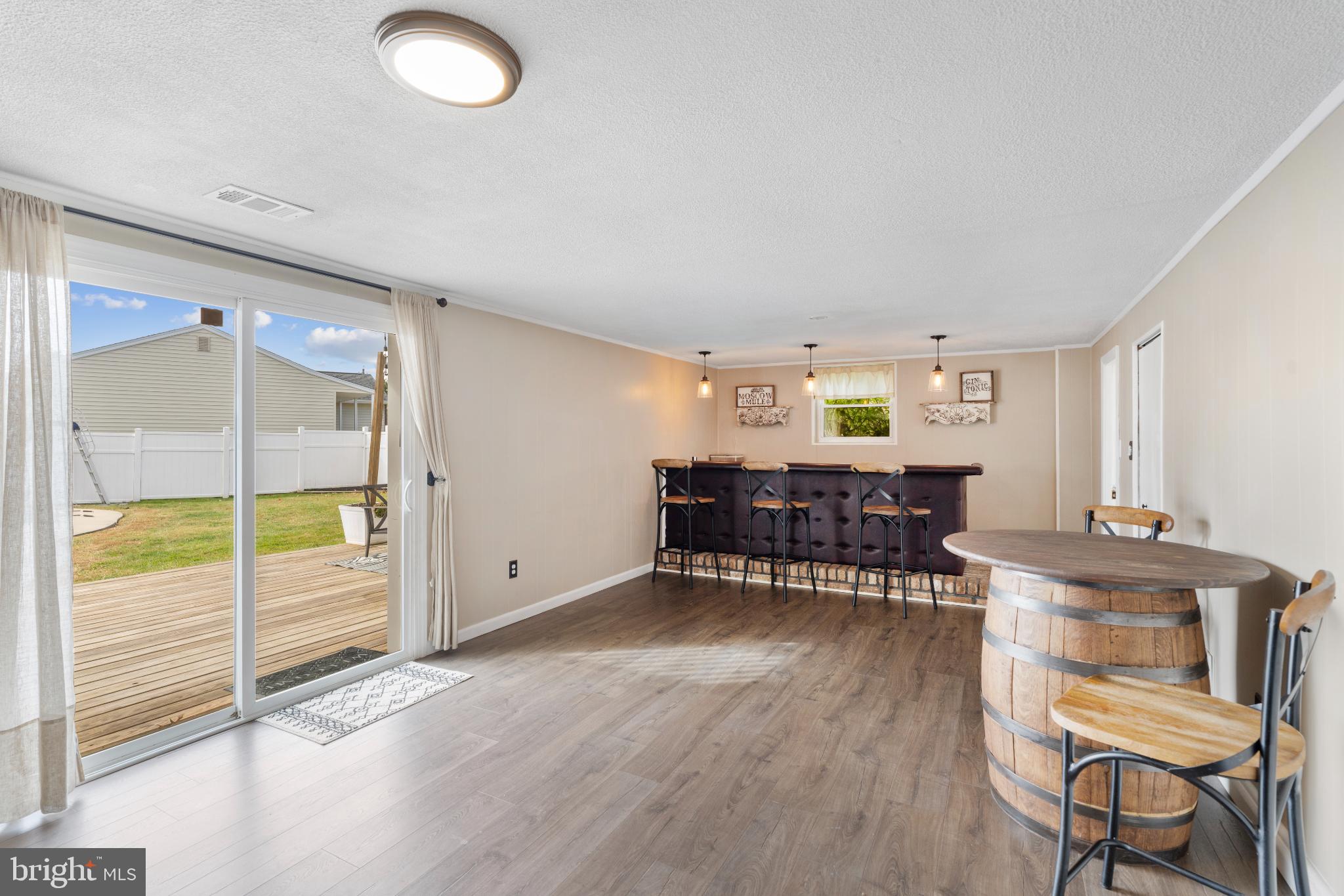 4501 Sandra Lake Road Perry Hall, MD 21128 - Photo 24 of 38 Inviting space with bar and outdoor access.