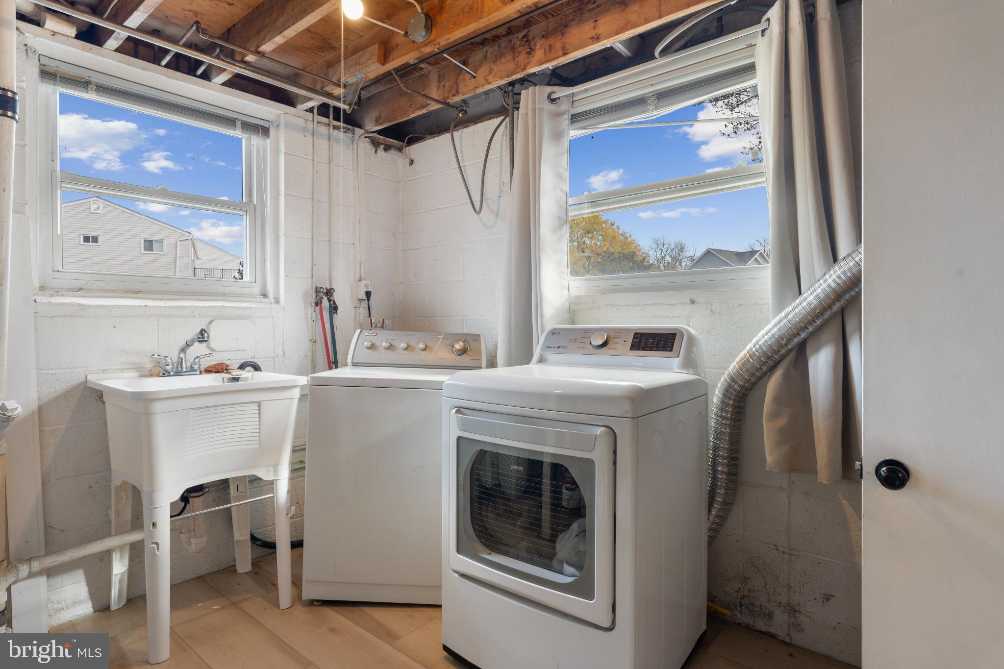 4501 Sandra Lake Road Perry Hall, MD 21128 - Photo 29 of 38 Bright and functional laundry space with windows.