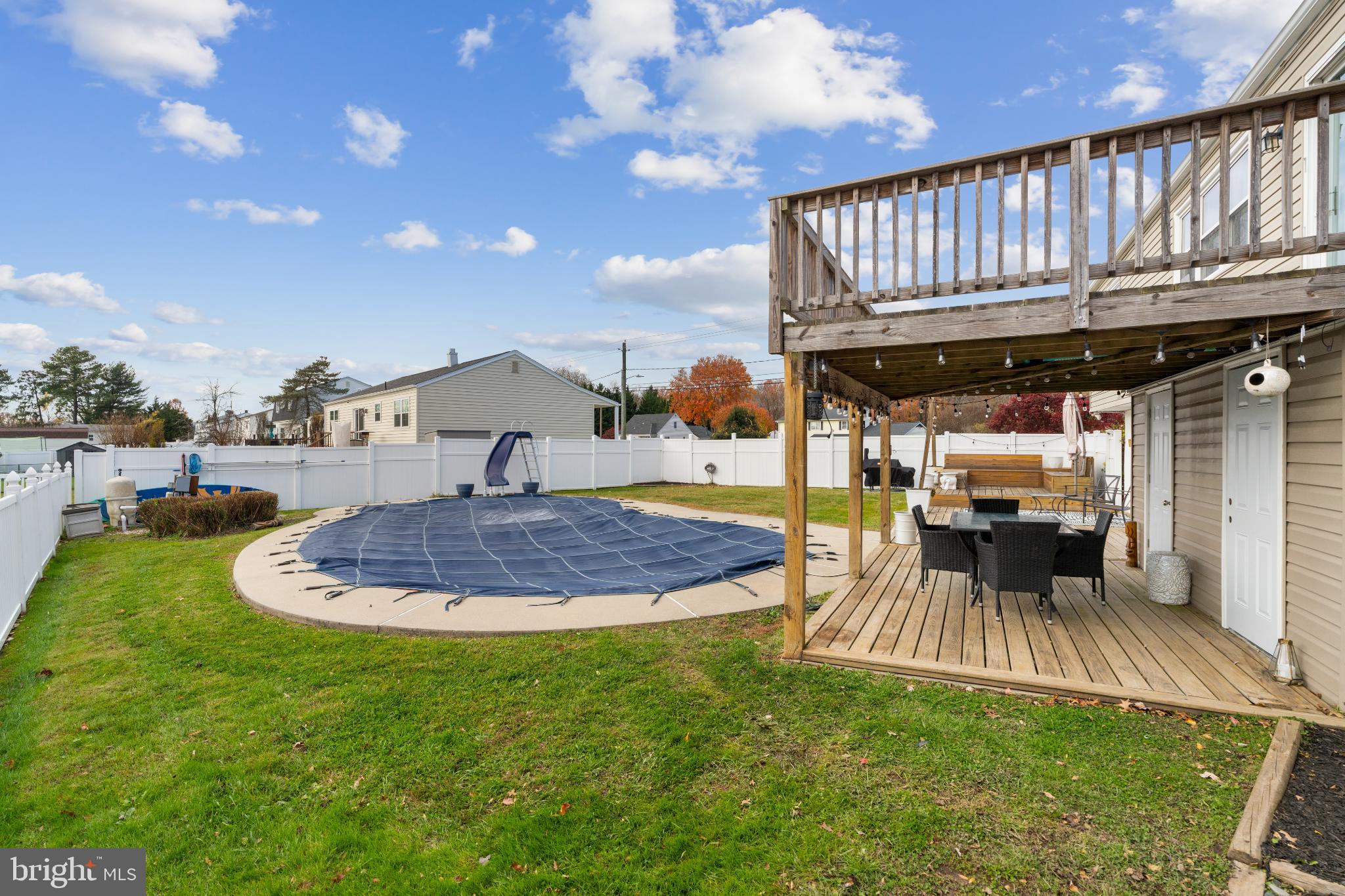 4501 Sandra Lake Road Perry Hall, MD 21128 - Photo 31 of 38 Charming backyard with pool and deck oasis.