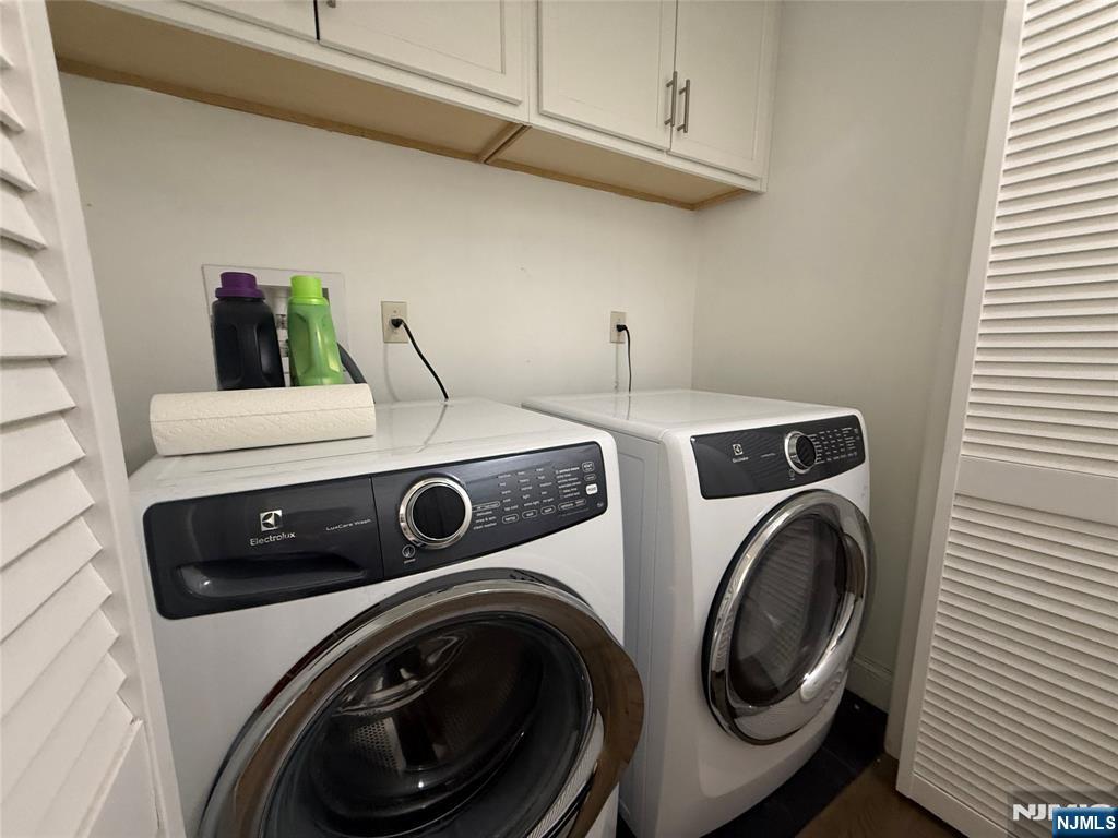 43 Jackson Avenue, Unit 1 Hackensack, NJ 07601 - Photo 11 of 14 a utility room with dryer and washer