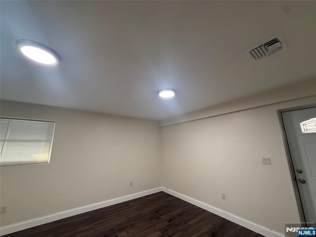 43 Jackson Avenue, Unit 1 Hackensack, NJ 07601 - Photo 13 of 14 a view of a room with wooden floor and fan