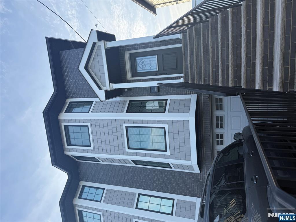 43 Jackson Avenue, Unit 1 Hackensack, NJ 07601 - Photo 2 of 14 a front view of a house