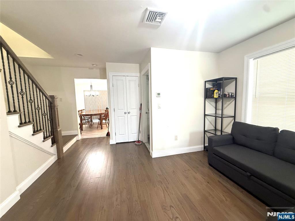 43 Jackson Avenue, Unit 1 Hackensack, NJ 07601 - Photo 6 of 14 a living room with furniture and a hard wood floor
