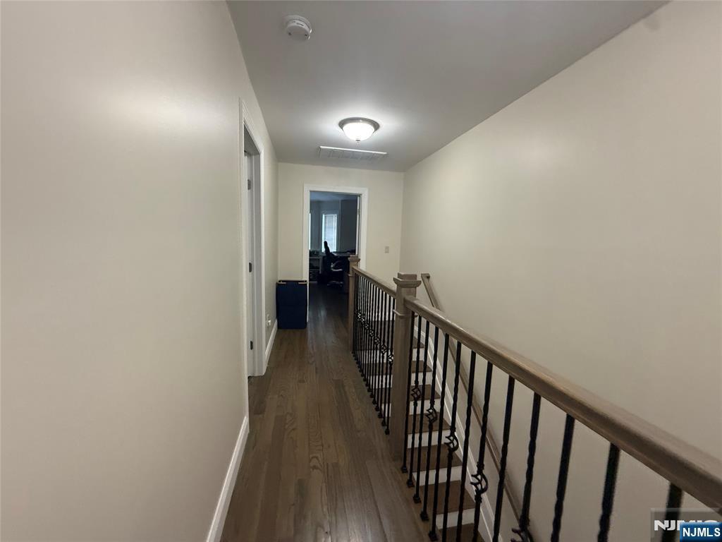 43 Jackson Avenue, Unit 1 Hackensack, NJ 07601 - Photo 7 of 14 a view of a hallway with wooden floor and staircase