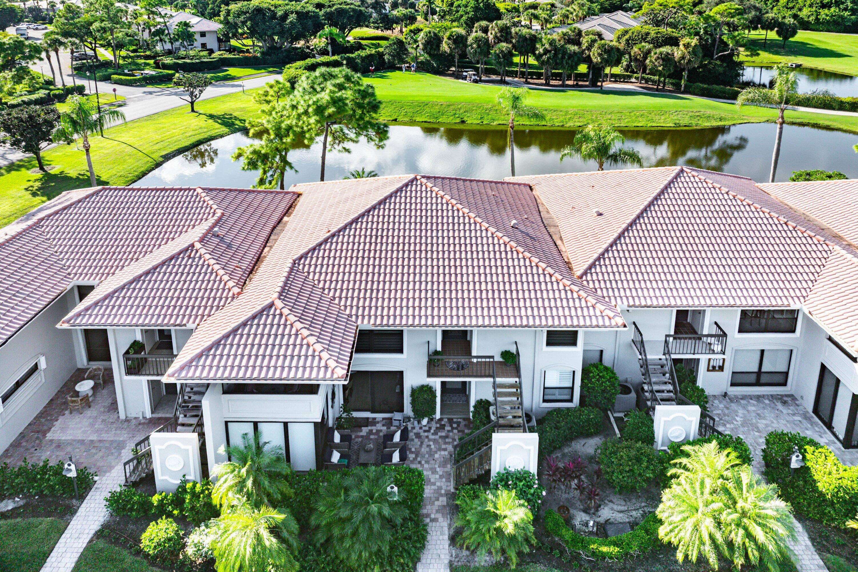 a aerial view of a house with a yard patio and swimming pool