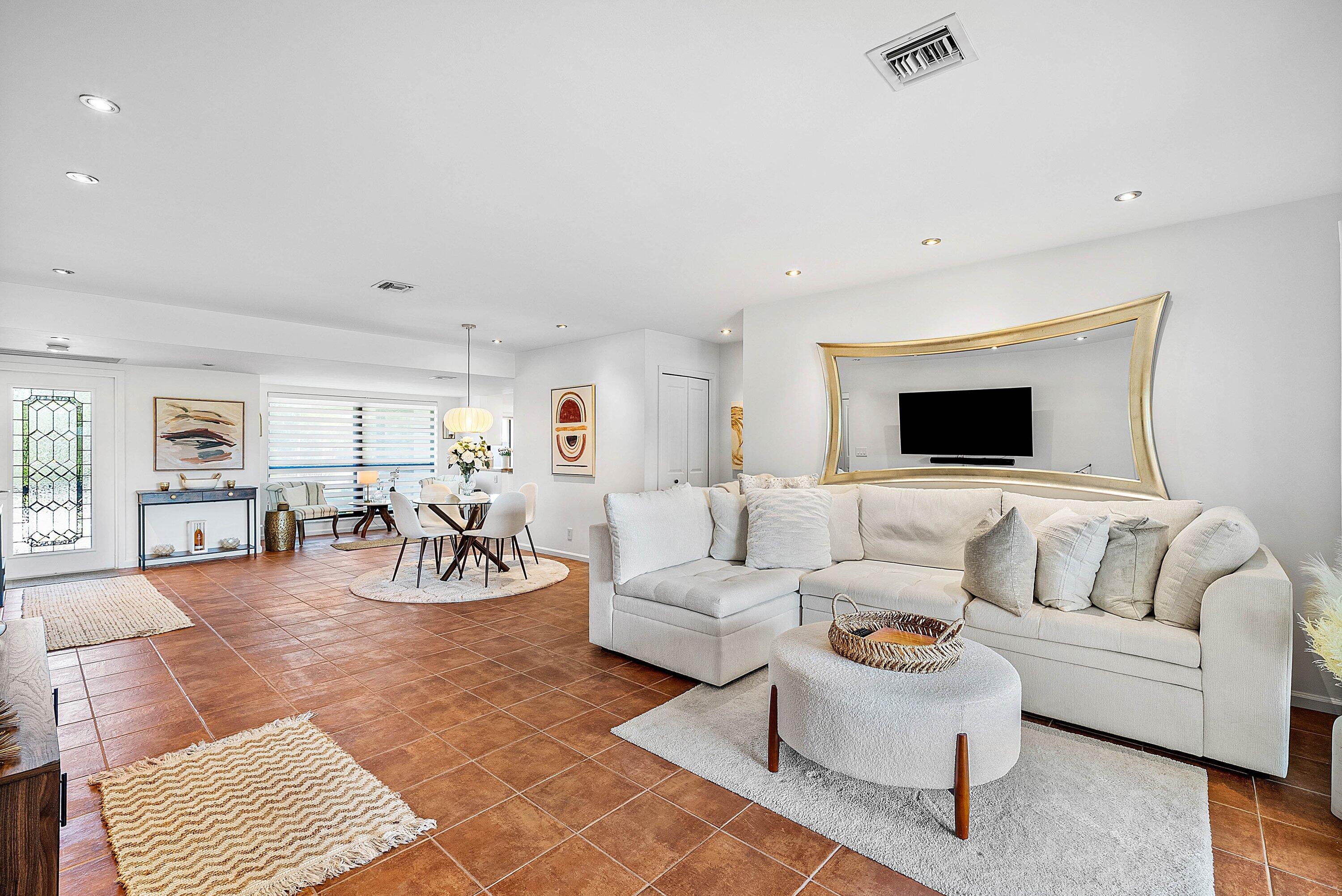 11126 Quail Covey Road, Unit MOCKINGBIRD Boynton Beach, FL 33436 - Photo 14 of 58 a living room with furniture and a flat screen tv