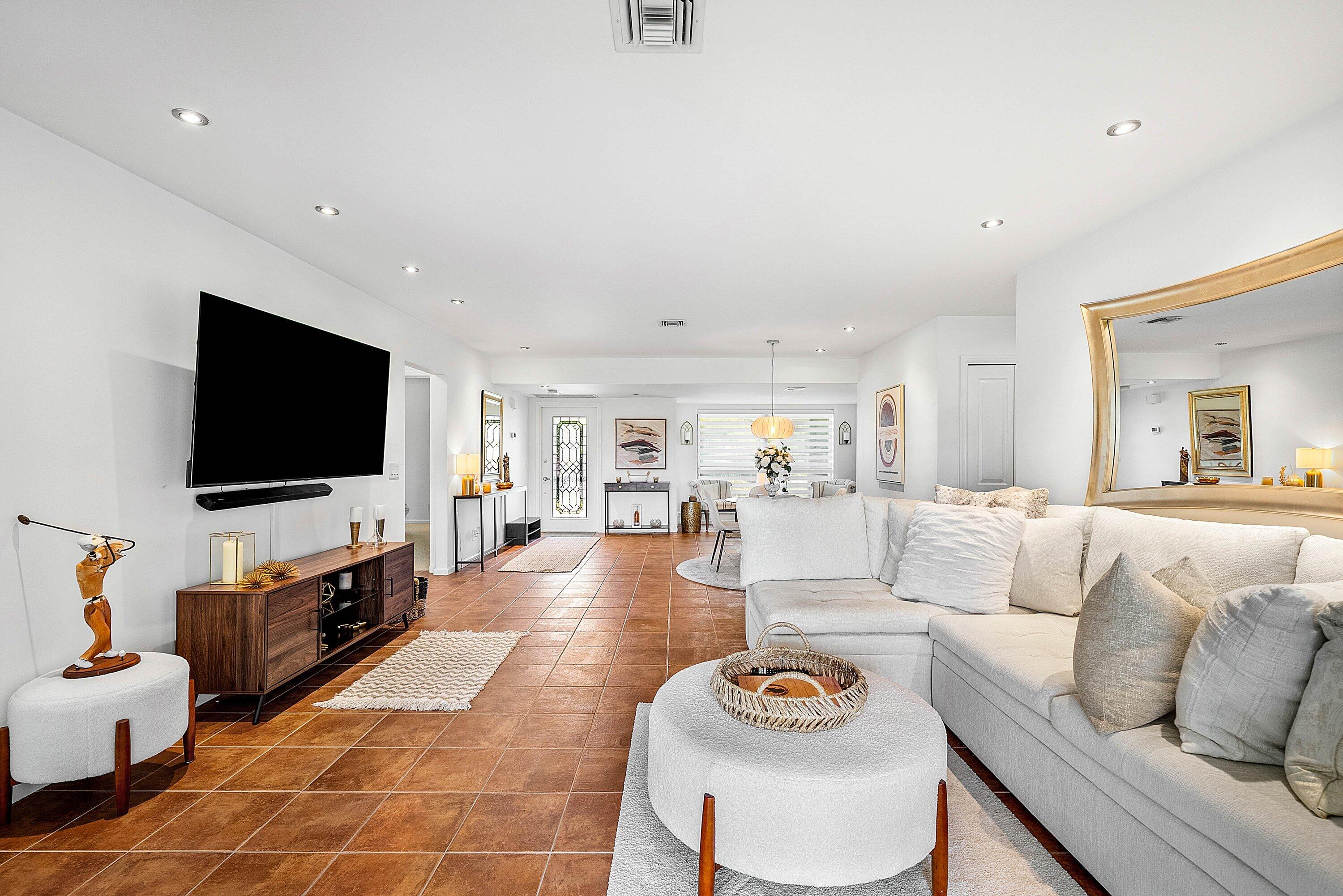 11126 Quail Covey Road, Unit MOCKINGBIRD Boynton Beach, FL 33436 - Photo 15 of 58 a living room with furniture and a flat screen tv