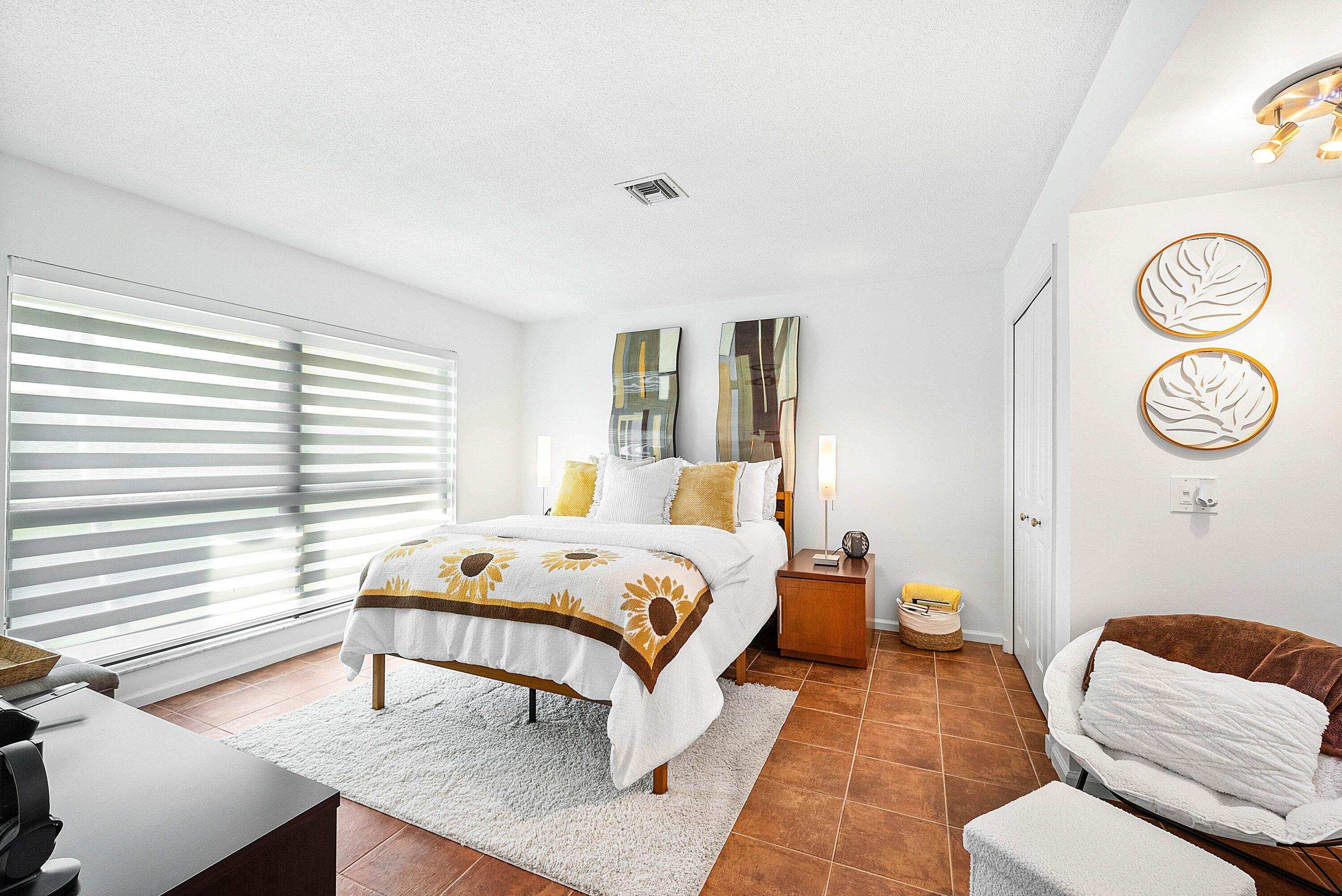 11126 Quail Covey Road, Unit MOCKINGBIRD Boynton Beach, FL 33436 - Photo 16 of 58 a bedroom with a bed and a window