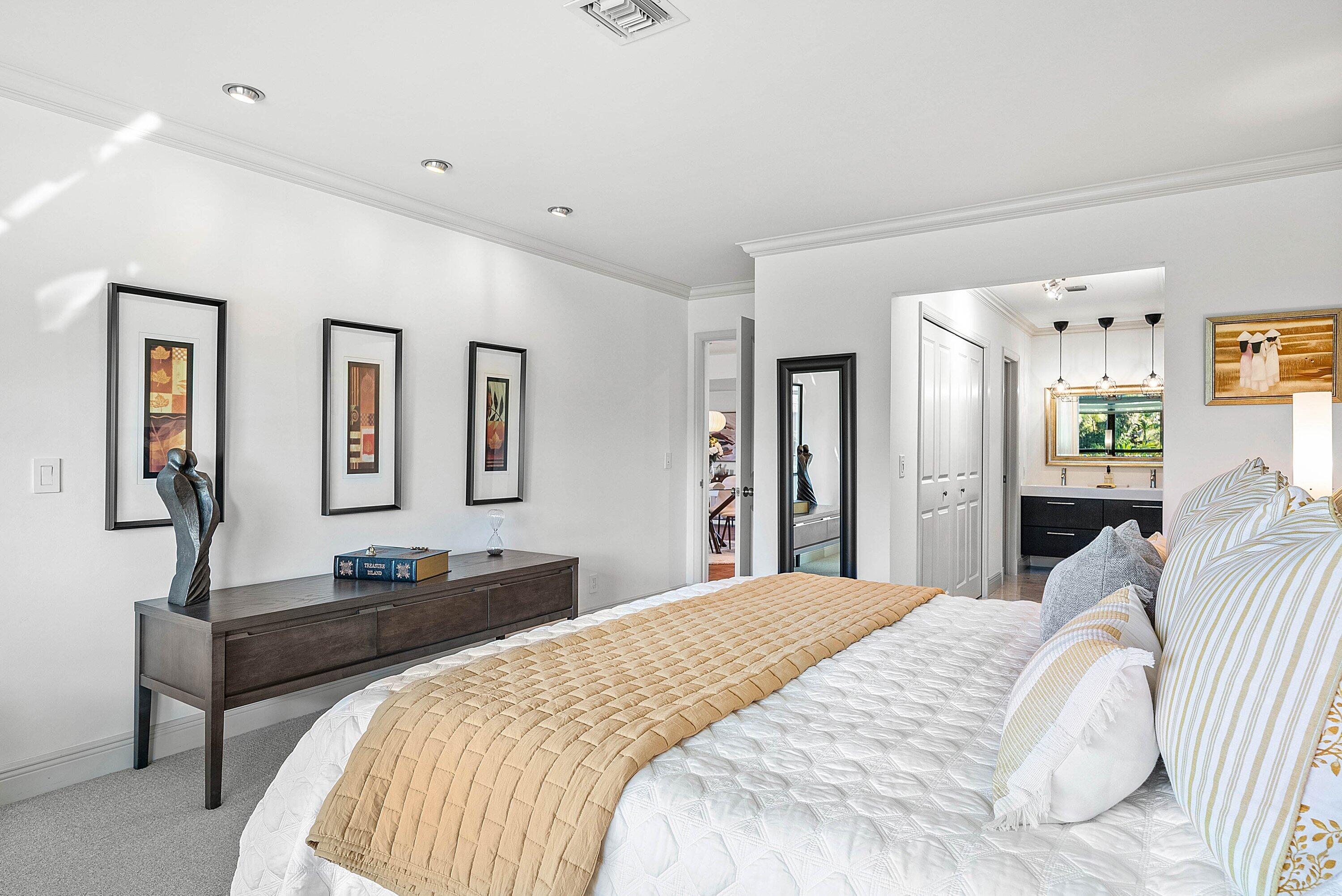 11126 Quail Covey Road, Unit MOCKINGBIRD Boynton Beach, FL 33436 - Photo 24 of 58 a bedroom with a bed and a dresser