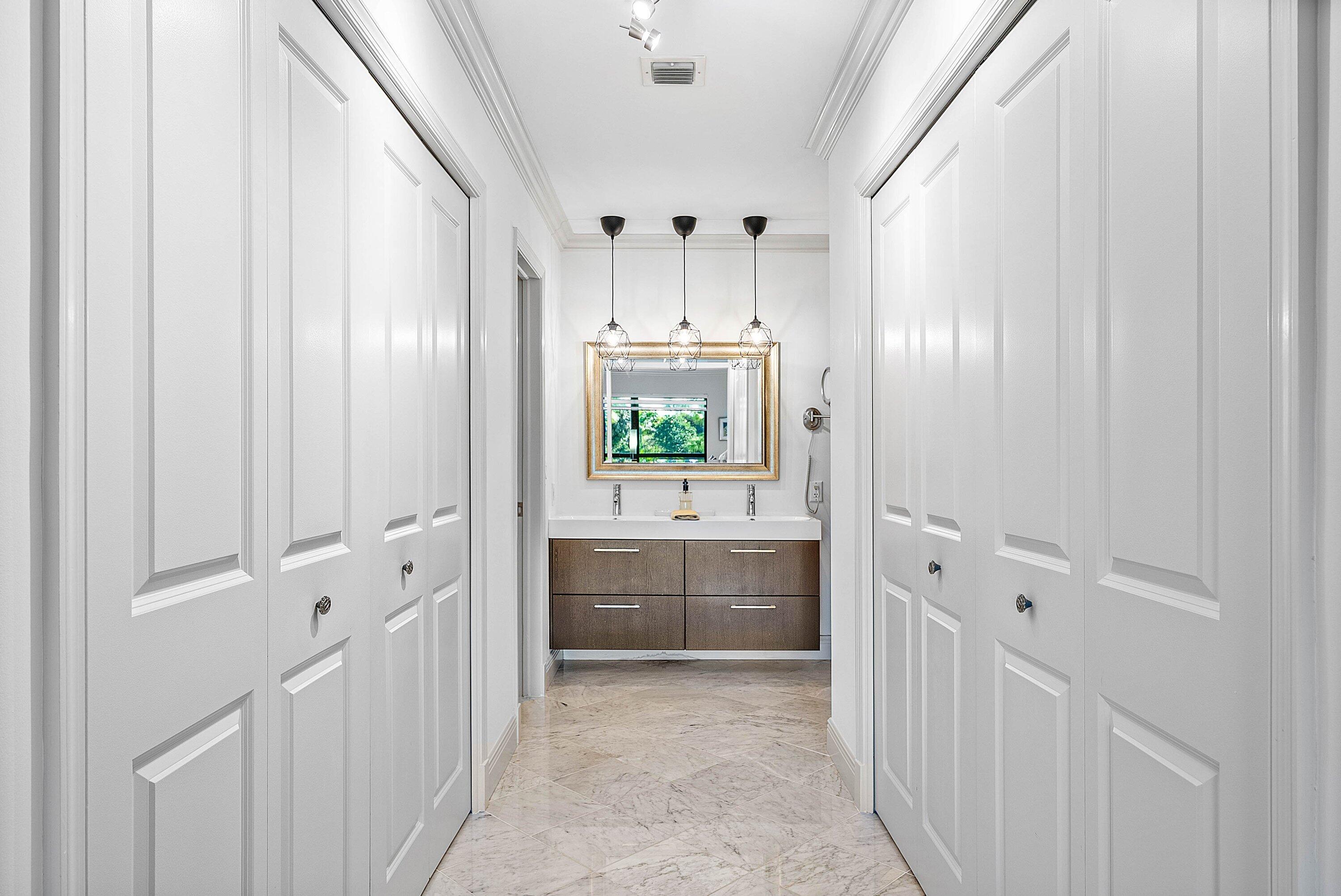 11126 Quail Covey Road, Unit MOCKINGBIRD Boynton Beach, FL 33436 - Photo 25 of 58 Main Closet & Bath