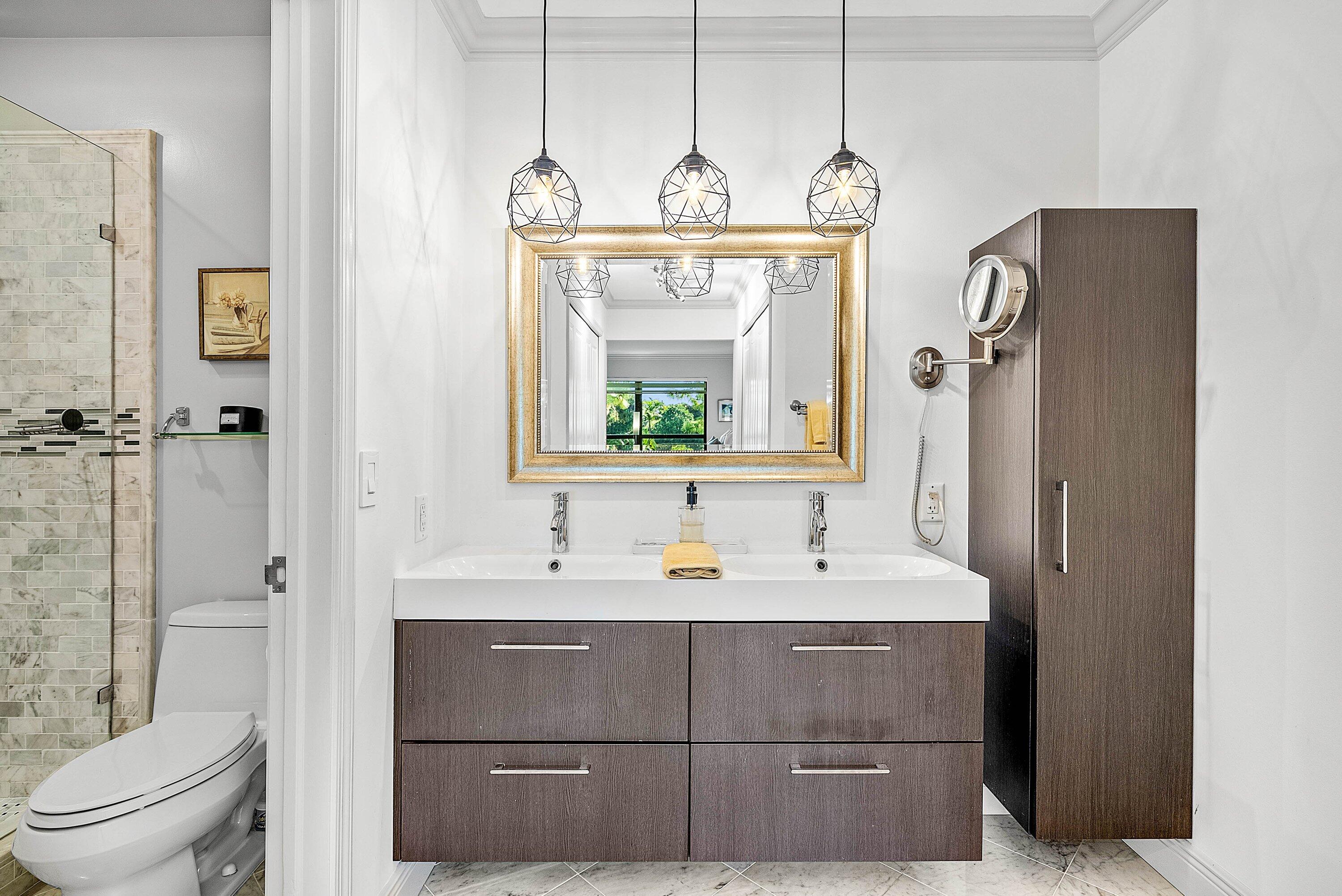 11126 Quail Covey Road, Unit MOCKINGBIRD Boynton Beach, FL 33436 - Photo 26 of 58 a bathroom with a sink a toilet and shower