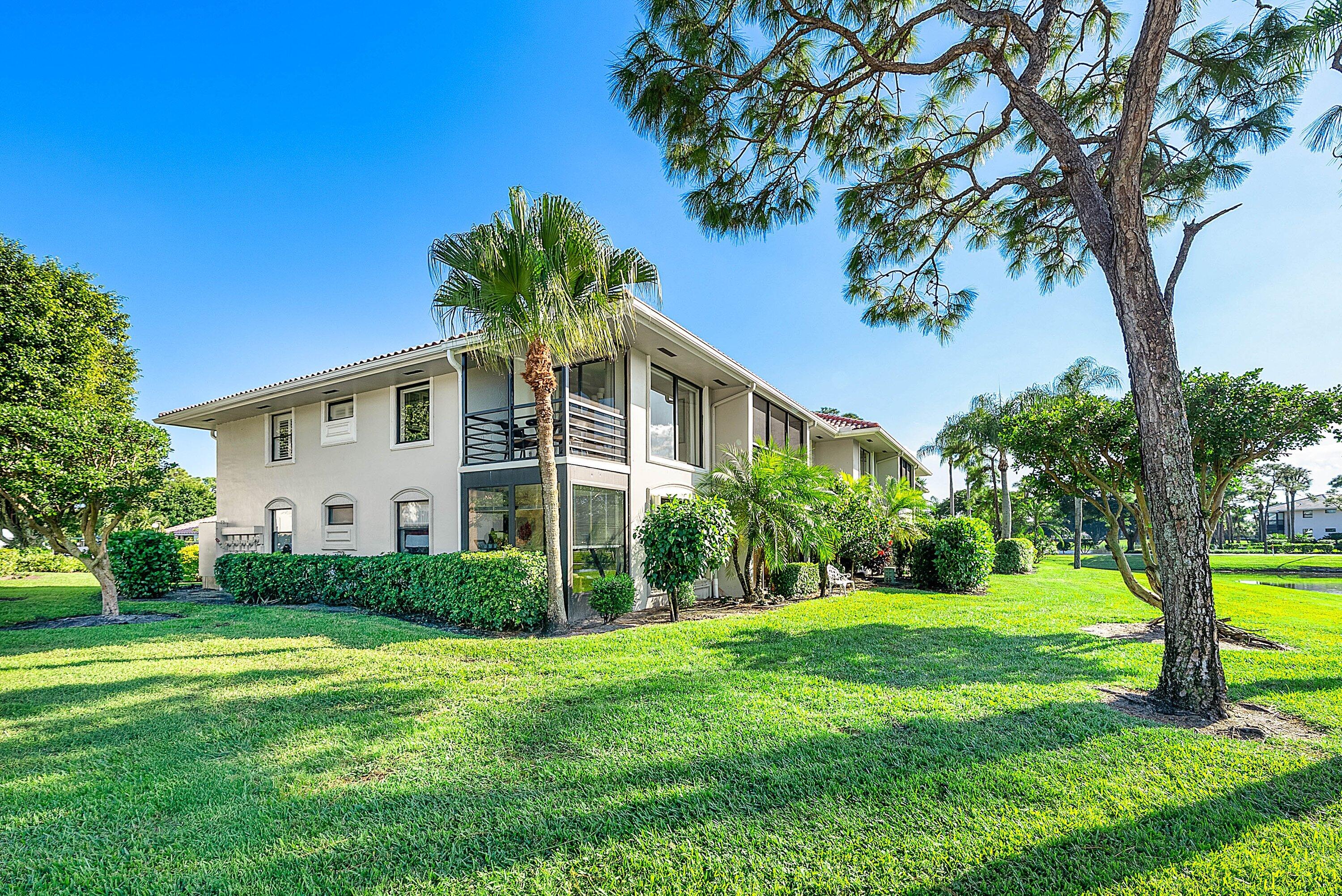 11126 Quail Covey Road, Unit MOCKINGBIRD Boynton Beach, FL 33436 - Photo 32 of 58 a house with garden in front of it