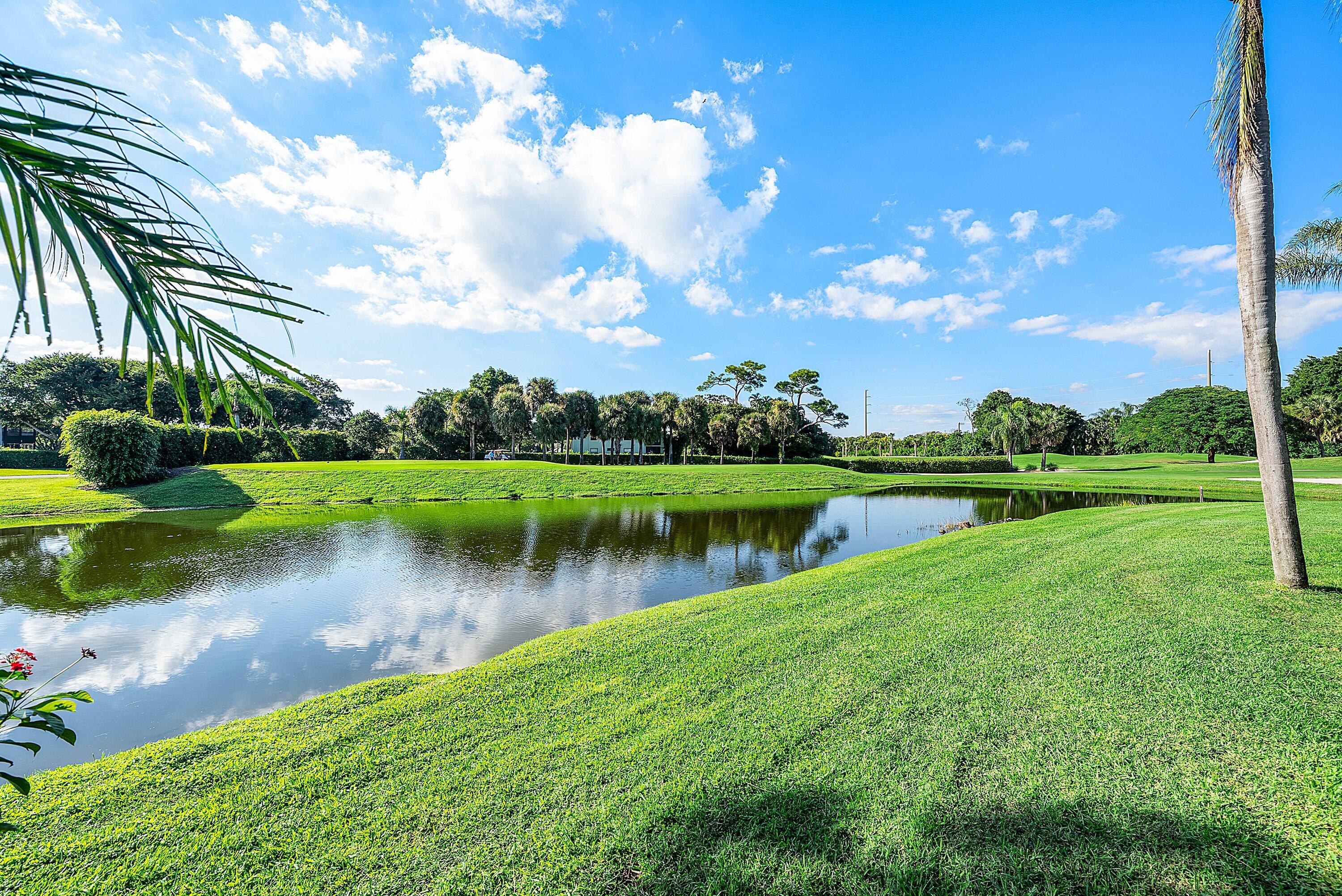 11126 Quail Covey Road, Unit MOCKINGBIRD Boynton Beach, FL 33436 - Photo 34 of 58 a view of a lake with a big yard
