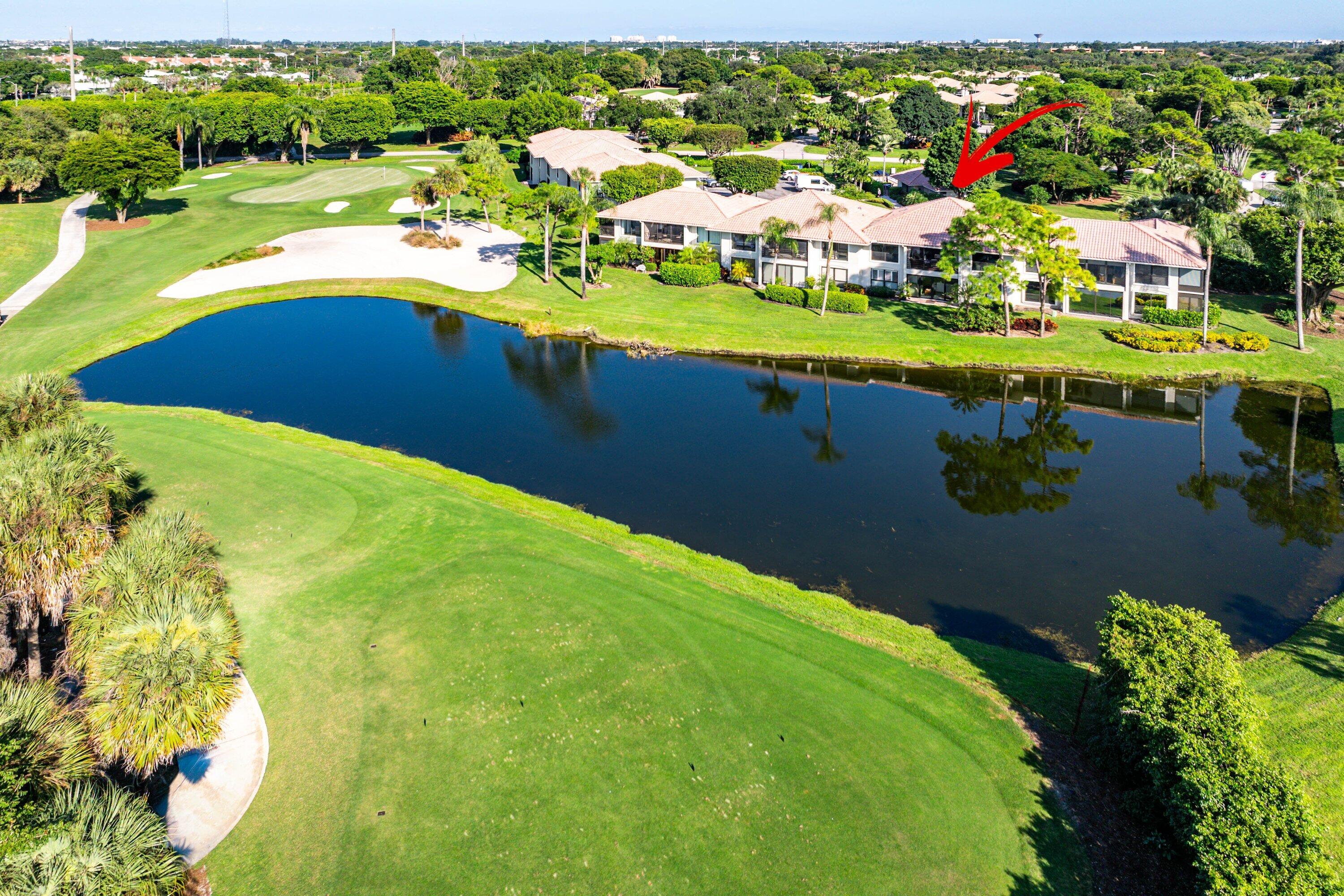 11126 Quail Covey Road, Unit MOCKINGBIRD Boynton Beach, FL 33436 - Photo 37 of 58 a view of a swimming pool with a yard