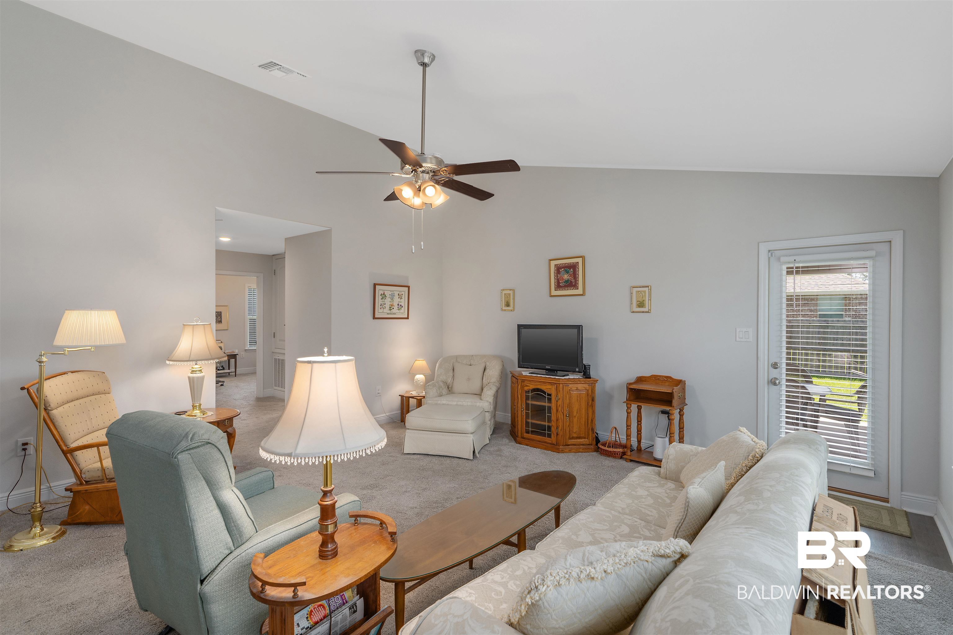 8823 Allay Lane Foley, AL 36535 - Photo 5 of 18 Living room with high vaulted ceiling, light carpet, and ceiling fan