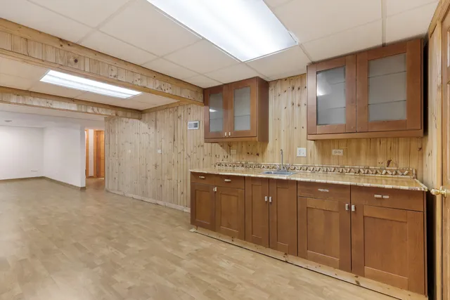 a bathroom with double sink and a mirror