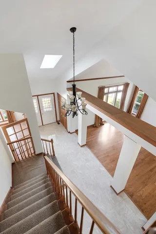 a view of a livingroom with furniture and staircase