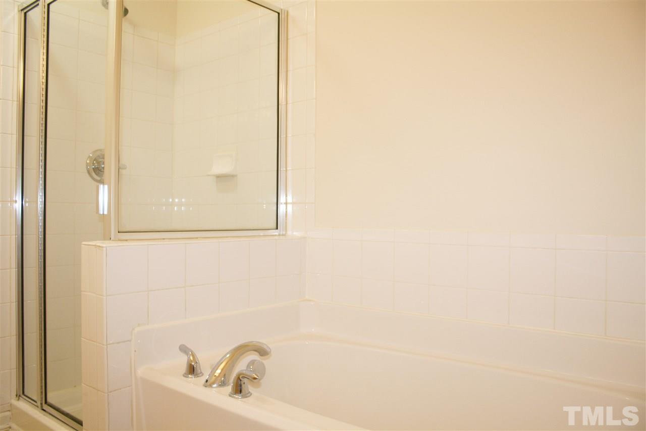 11720 Mezzanine Drive, Unit 103 Raleigh, NC 27614 - Photo 13 of 21 a bathroom with a bathtub