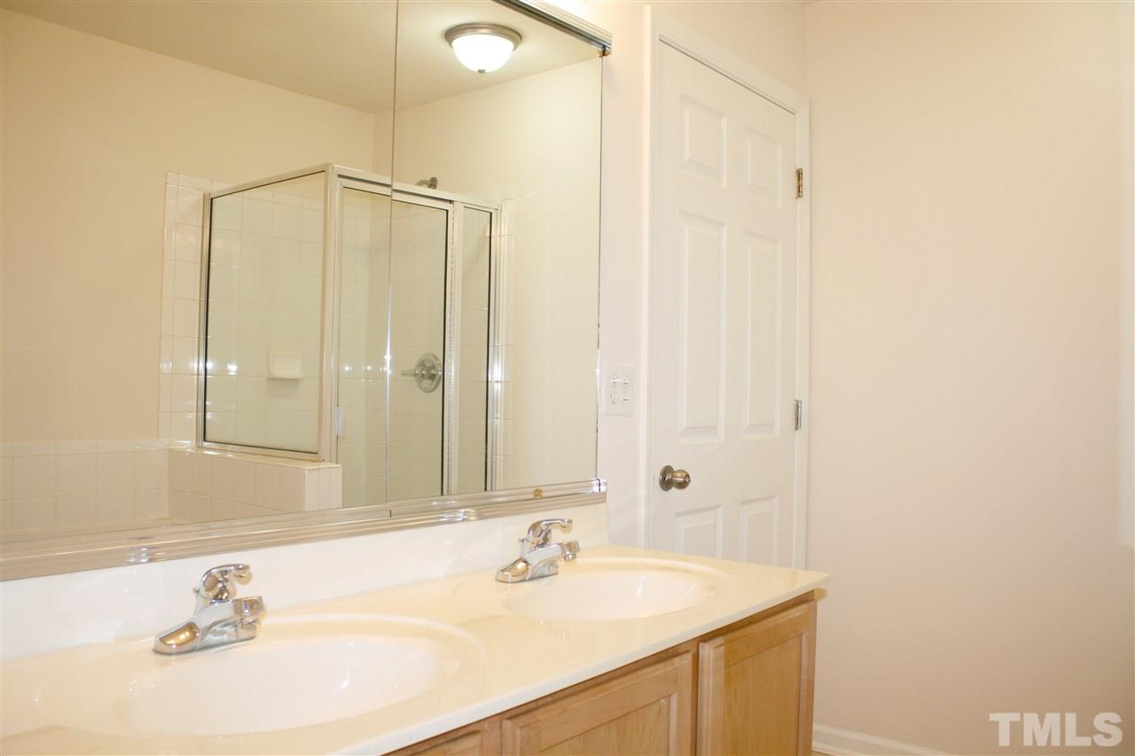 11720 Mezzanine Drive, Unit 103 Raleigh, NC 27614 - Photo 14 of 21 a bathroom with a sink and a mirror