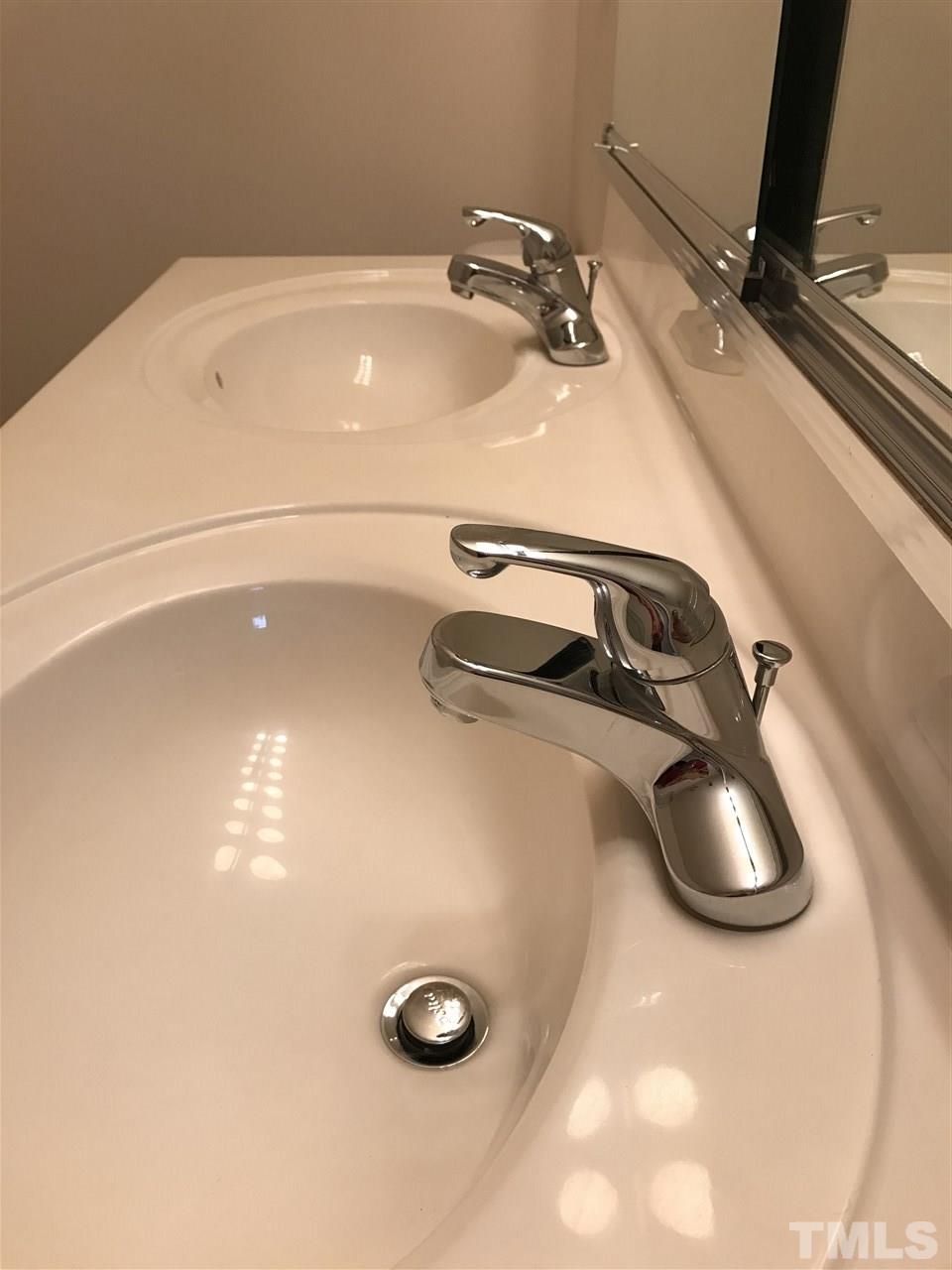11720 Mezzanine Drive, Unit 103 Raleigh, NC 27614 - Photo 15 of 21 a bathroom with a sink