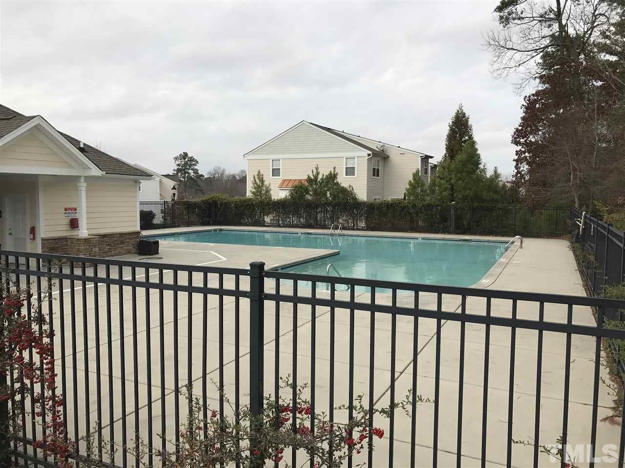 11720 Mezzanine Drive, Unit 103 Raleigh, NC 27614 - Photo 21 of 21 a view of a roof deck with wooden fence and floor