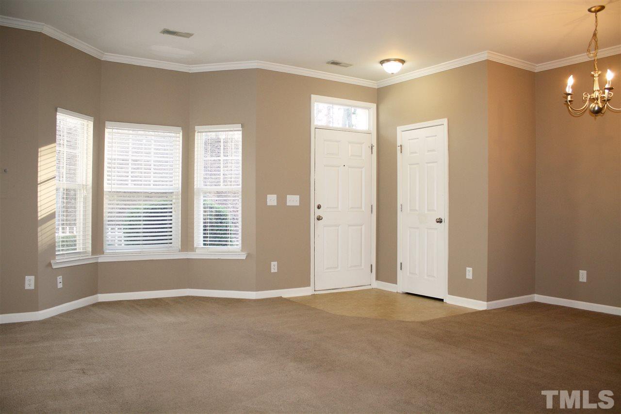 11720 Mezzanine Drive, Unit 103 Raleigh, NC 27614 - Photo 4 of 21 a view of an empty room with a window