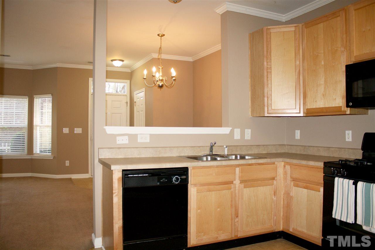 11720 Mezzanine Drive, Unit 103 Raleigh, NC 27614 - Photo 9 of 21 a kitchen with a sink and cabinets