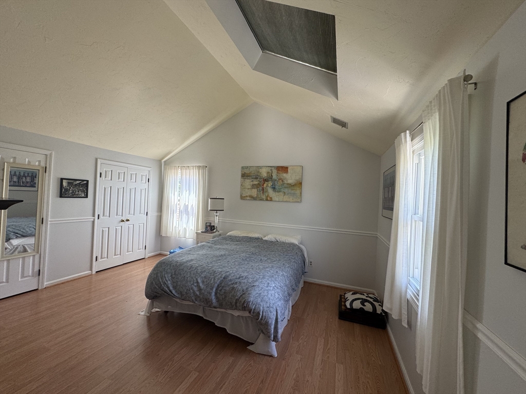 38 Crescent Road, Unit 38 Needham, MA 02494 - Photo 9 of 23 a bedroom with a bed and a dresser