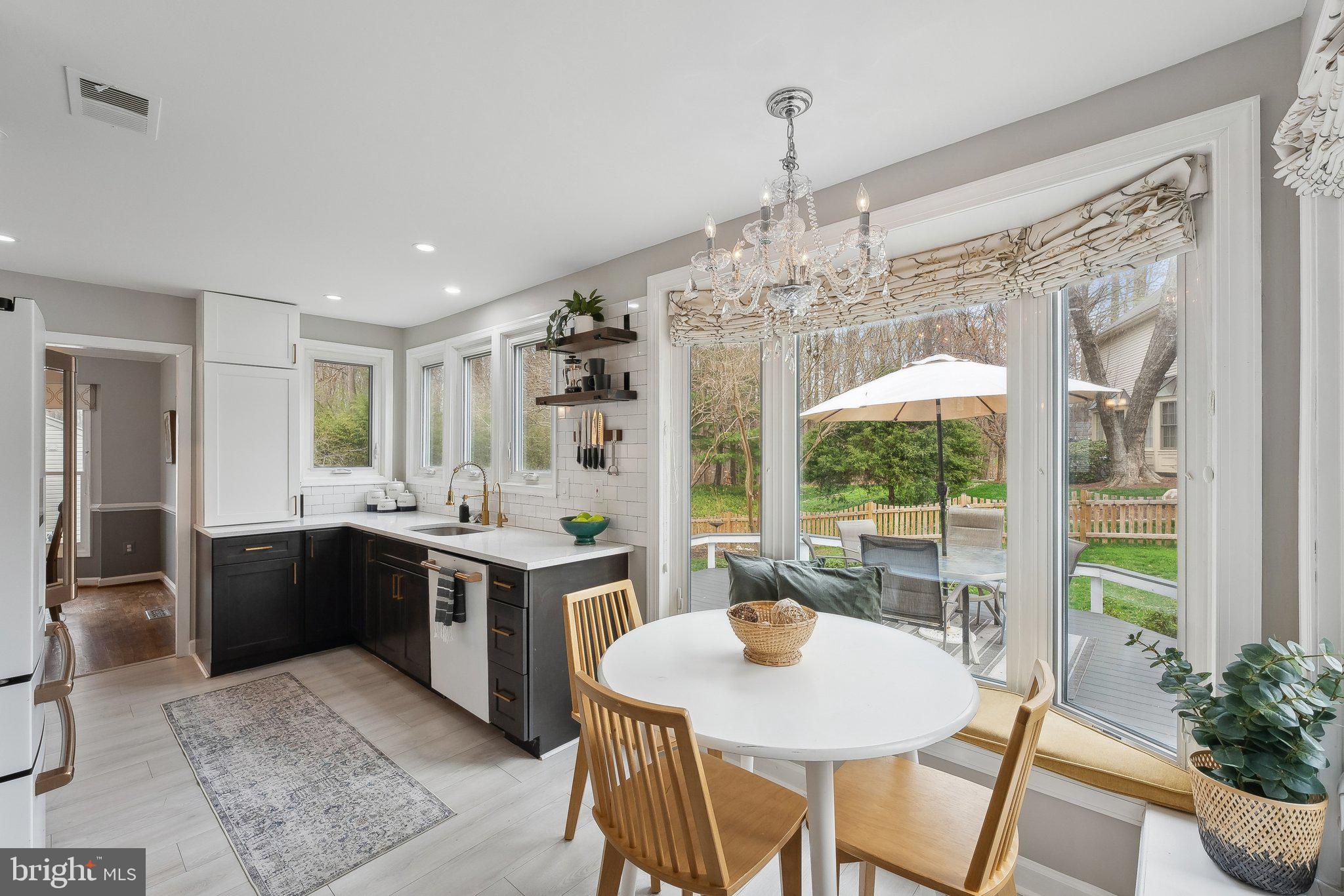 7940 Donegal Lane Springfield, VA 22153 - Photo 11 of 36 a kitchen with a table and chairs