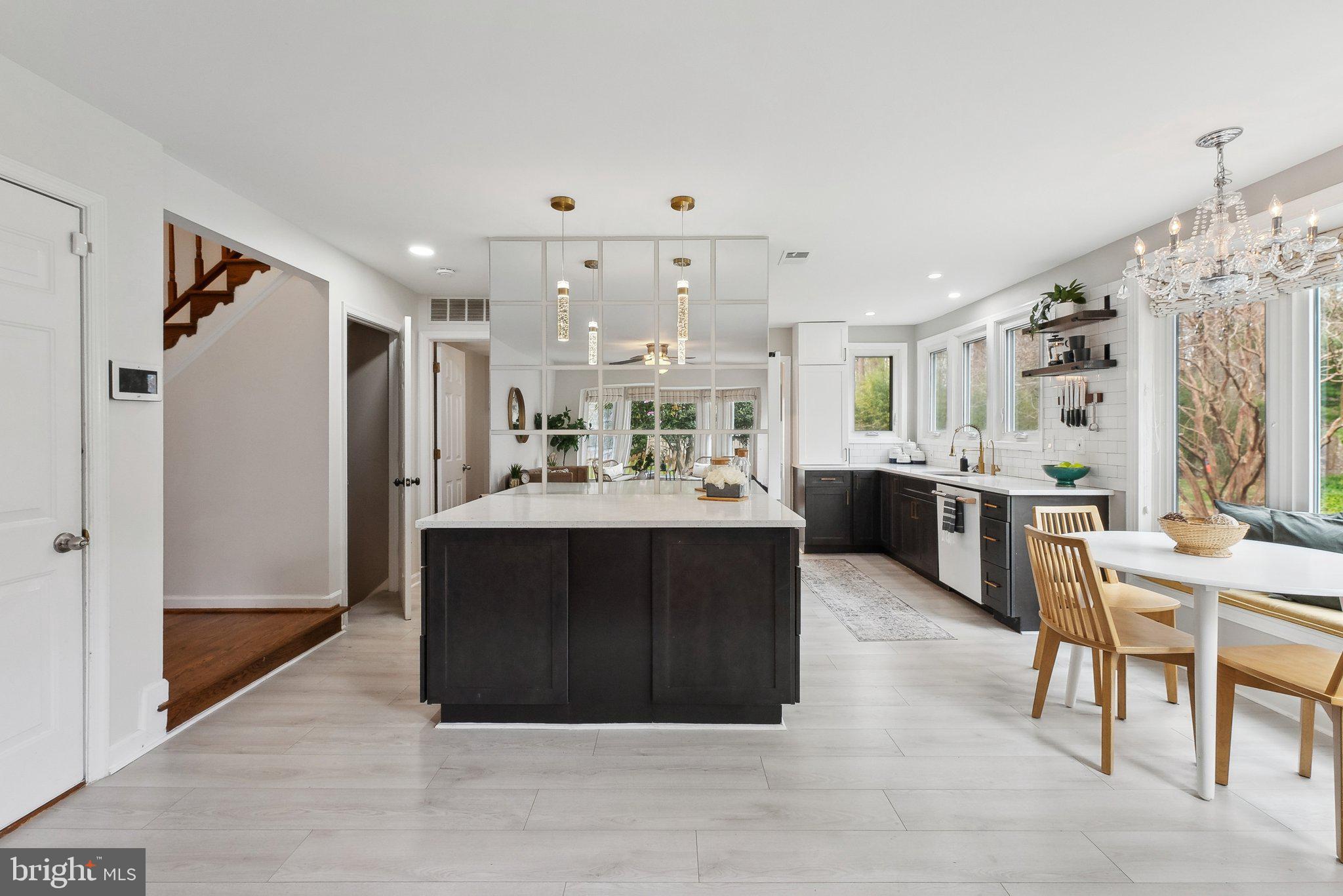 7940 Donegal Lane Springfield, VA 22153 - Photo 12 of 36 a kitchen with stainless steel appliances kitchen island granite countertop a refrigerator and a sink