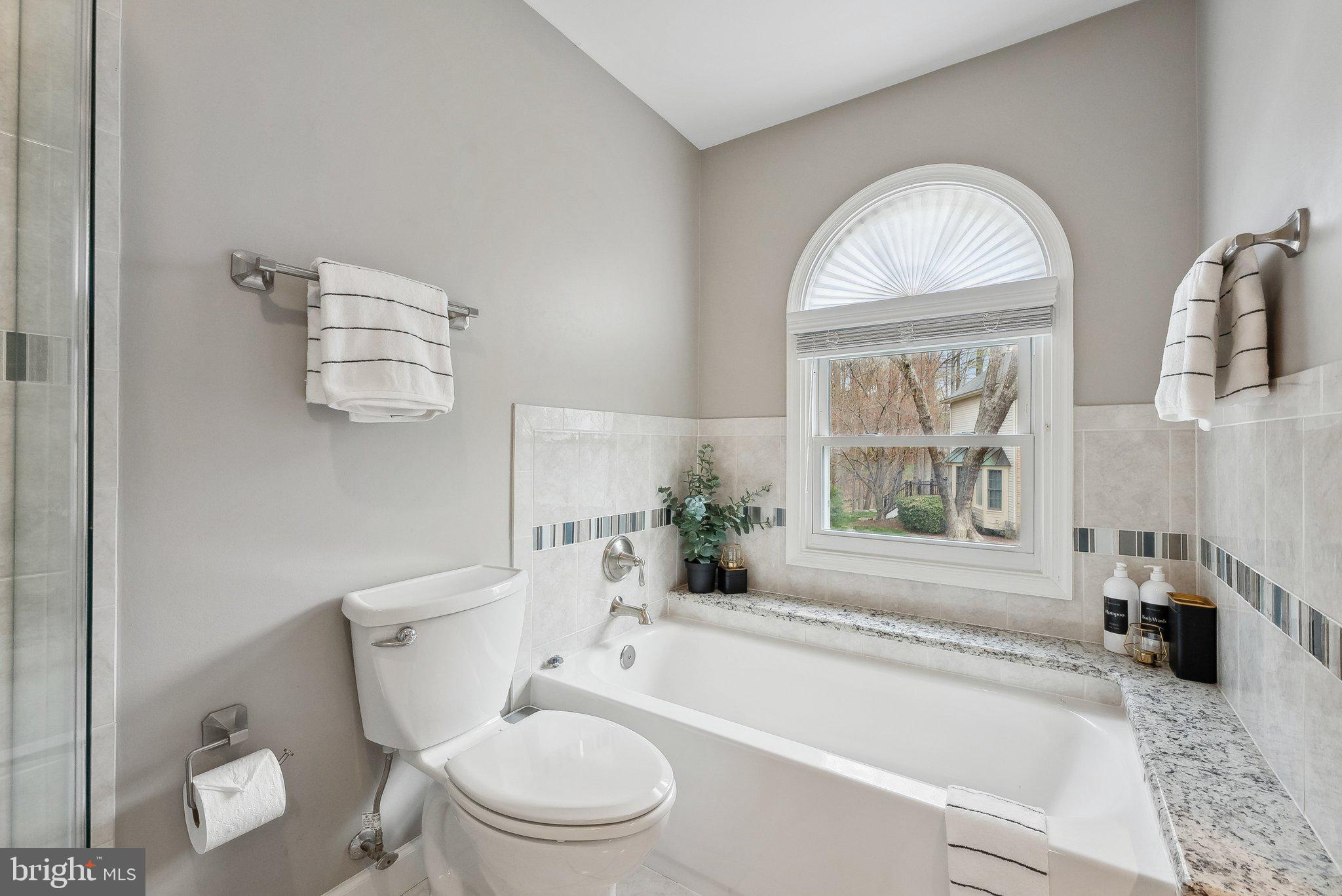 7940 Donegal Lane Springfield, VA 22153 - Photo 18 of 36 a bathroom with a toilet a sink and a bathtub