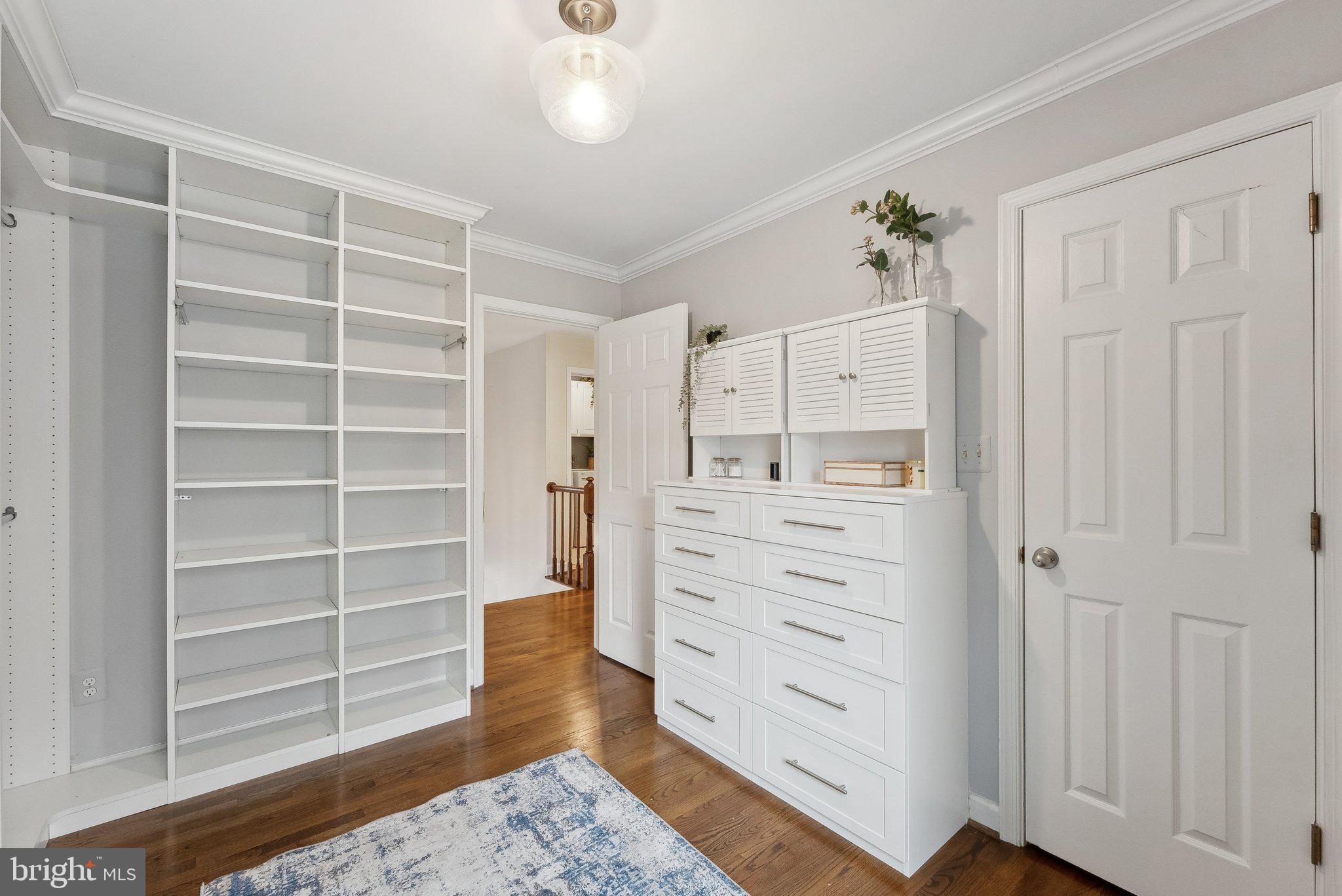 7940 Donegal Lane Springfield, VA 22153 - Photo 21 of 36 a view of walk in closet and wooden shelves