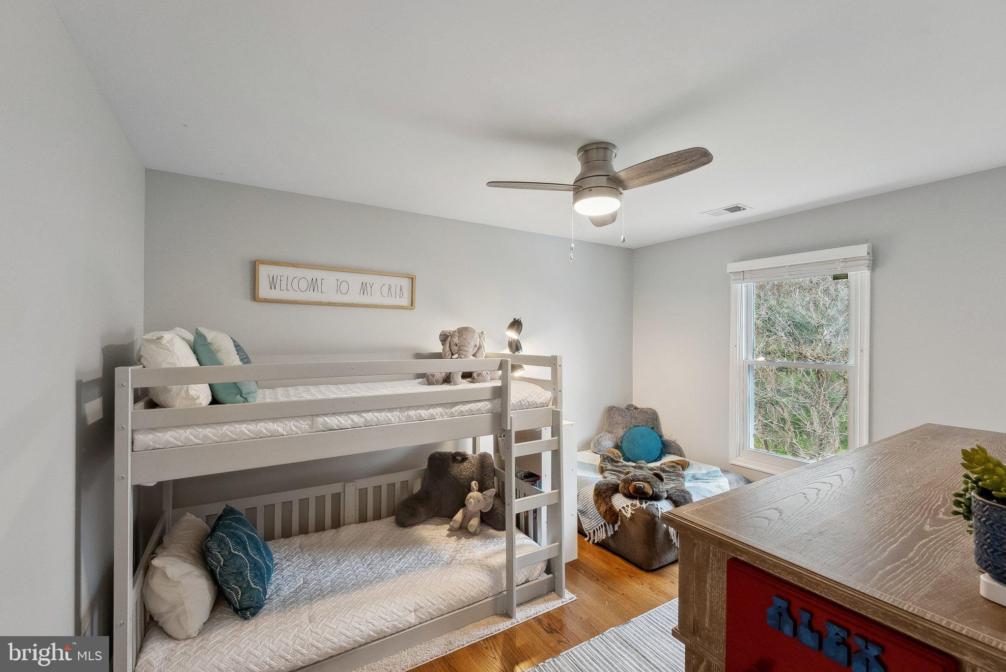 7940 Donegal Lane Springfield, VA 22153 - Photo 22 of 36 a bedroom with a bed and a chandelier