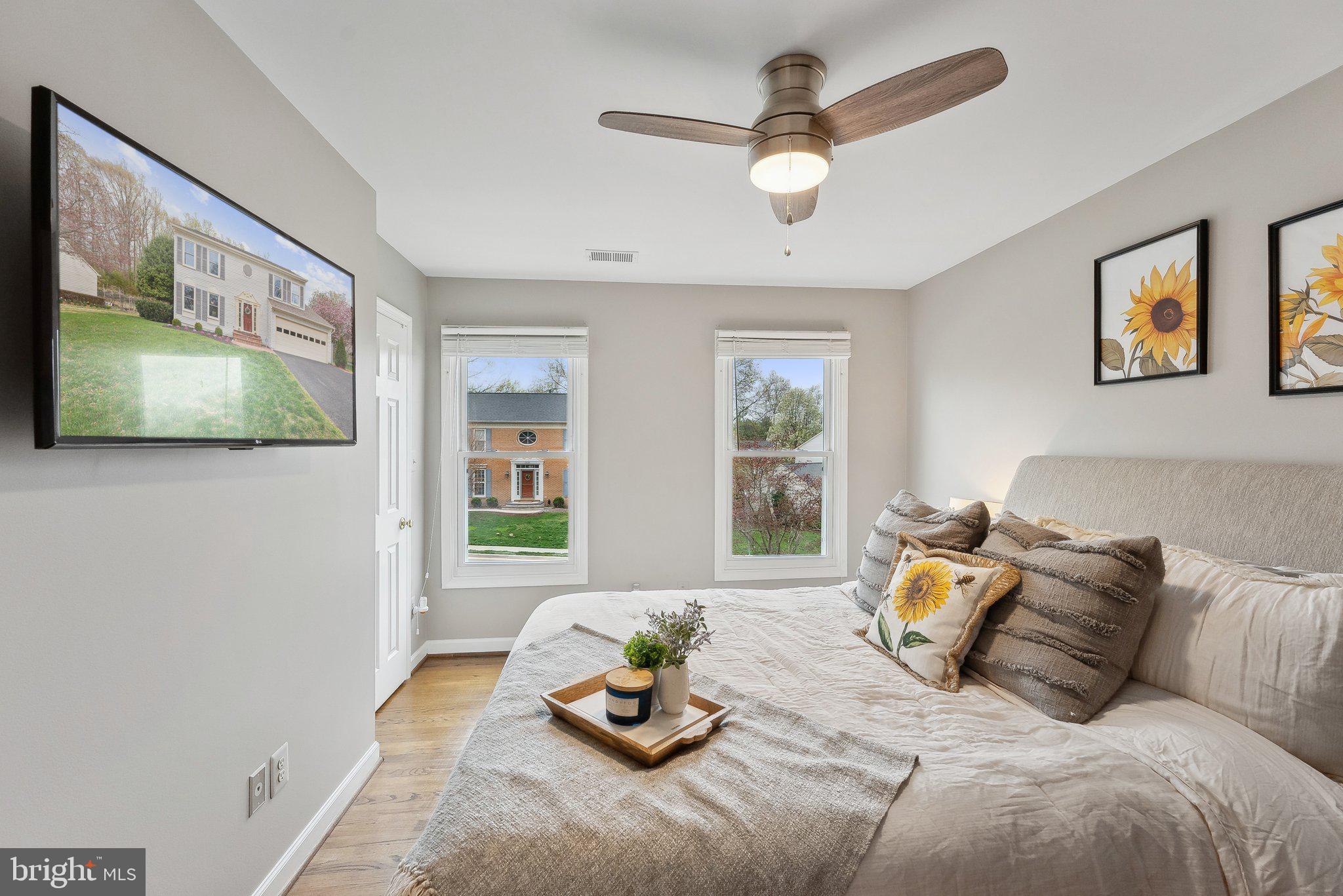 7940 Donegal Lane Springfield, VA 22153 - Photo 25 of 36 a bedroom with a bed couches and window